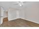 Spacious bedroom with wood floors, a ceiling fan, and closet space at 4309 Birmingham Way, Raleigh, NC 27604