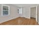Cozy bedroom with hardwood floors and natural light from two windows at 4309 Birmingham Way, Raleigh, NC 27604