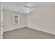 Bedroom featuring neutral carpet, a window and a ceiling fan at 4309 Birmingham Way, Raleigh, NC 27604