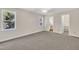 Bedroom featuring neutral walls, carpet flooring, a closet, and large windows at 4309 Birmingham Way, Raleigh, NC 27604