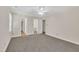 Bedroom featuring neutral walls, carpet flooring, closets, and multiple doorways at 4309 Birmingham Way, Raleigh, NC 27604