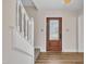 Welcoming foyer featuring modern flooring, a staircase, and an attractive front door with decorative glass at 4309 Birmingham Way, Raleigh, NC 27604