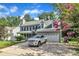 Well-maintained two-story home with an attached garage, concrete driveway, and landscaping at 4309 Birmingham Way, Raleigh, NC 27604