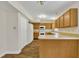Bright kitchen featuring wooden cabinets and modern appliances at 4309 Birmingham Way, Raleigh, NC 27604