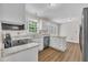 Modern kitchen features stainless steel appliances, granite countertops, and white cabinets at 4309 Birmingham Way, Raleigh, NC 27604