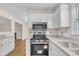 Well-equipped kitchen featuring modern appliances, granite countertops and a gas range at 4309 Birmingham Way, Raleigh, NC 27604