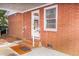 Covered porch with brick steps, offering a cozy outdoor space and convenient access at 452 N Main St, Wendell, NC 27591