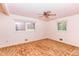 Bright bedroom with ceiling fan and natural light from two windows at 452 N Main St, Wendell, NC 27591