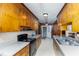 Classic kitchen with ample wood cabinetry and a functional layout for cooking and storage at 452 N Main St, Wendell, NC 27591