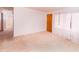Inviting living room with neutral carpet and natural light, creating a warm atmosphere at 452 N Main St, Wendell, NC 27591