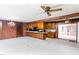 Open living space featuring wood accents, and access to the kitchen and outdoor views at 452 N Main St, Wendell, NC 27591