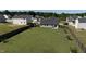 Aerial view of the backyard with large lawn and privacy fence at 46 Bellini Dr, Angier, NC 27501