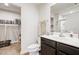 Bathroom featuring vanity, mirror, toilet, walk-in closet and shower at 46 Bellini Dr, Angier, NC 27501
