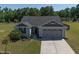 Aerial view of the home's exterior featuring a two-car garage at 46 Bellini Dr, Angier, NC 27501