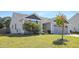 Charming single-story home featuring a well-maintained lawn, a two-car garage, and tasteful landscaping at 46 Bellini Dr, Angier, NC 27501