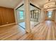 Well-lit office space with hardwood floors, and glass enclosed book-shelving at 48 Firefly Ln, Fuquay Varina, NC 27526