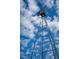 Close-up of a classic windmill set against a beautiful blue sky with white clouds at 48 Firefly Ln, Fuquay Varina, NC 27526