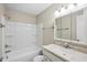 Clean bathroom featuring a tub with shower, and a vanity with ample storage space at 5082 Flint Ridge Pl, Raleigh, NC 27609