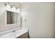 Bright bathroom with a vanity, sink, mirror, and ample lighting at 5082 Flint Ridge Pl, Raleigh, NC 27609