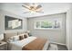 Cozy bedroom featuring a large window for natural light and soft, neutral decor at 5082 Flint Ridge Pl, Raleigh, NC 27609