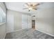 Neutral bedroom featuring soft carpet, a ceiling fan, and closet space at 5082 Flint Ridge Pl, Raleigh, NC 27609