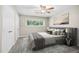 Cozy bedroom featuring neutral colors, plush carpet, and a ceiling fan for added comfort at 5082 Flint Ridge Pl, Raleigh, NC 27609