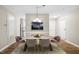 Chic dining room with a stylish chandelier, elegant furniture, and hardwood floors at 5082 Flint Ridge Pl, Raleigh, NC 27609