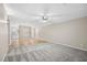 Bright living room with hardwood floors connecting to the kitchen area at 5082 Flint Ridge Pl, Raleigh, NC 27609