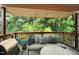 A furnished outdoor patio provides relaxation and views of nature at 5082 Flint Ridge Pl, Raleigh, NC 27609