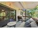 A covered patio featuring a cozy seating area and outdoor grill at 5082 Flint Ridge Pl, Raleigh, NC 27609