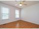 Bedroom featuring a ceiling fan, laminate flooring, and two windows at 516 Yellow Berry, Wendell, NC 27591