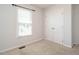 Bedroom featuring neutral carpet, a window, and a closet at 516 Yellow Berry, Wendell, NC 27591
