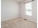 Bright bedroom featuring neutral carpet, a window providing ample natural light, and fresh paint at 516 Yellow Berry, Wendell, NC 27591