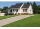 This single story home features a well maintained lawn and long driveway for easy access at 516 Yellow Berry, Wendell, NC 27591