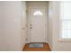 Bright foyer features hardwood floors, white door, and natural light from the window at 516 Yellow Berry, Wendell, NC 27591