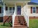 Welcoming front porch and vibrant door leads to a cozy home, and inviting entrance at 516 Yellow Berry, Wendell, NC 27591