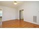 Open living space with high ceiling, hardwood floors, and access to other parts of the home at 516 Yellow Berry, Wendell, NC 27591