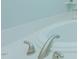 Close up shot of the tub that features white walls and a granite countertop at 5307 Green Riley Rd, Rougemont, NC 27572