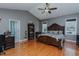 Spacious bedroom featuring vaulted ceiling, decorative furnishings, and wood flooring at 5307 Green Riley Rd, Rougemont, NC 27572