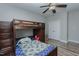 A bedroom with vinyl flooring, bunk beds, ceiling fan, and a closet at 5307 Green Riley Rd, Rougemont, NC 27572