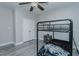 A bedroom with gray vinyl floors, a bunk bed, a ceiling fan, and a closet at 5307 Green Riley Rd, Rougemont, NC 27572