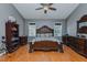 Spacious bedroom featuring decorative furnishings, wood flooring, and natural light at 5307 Green Riley Rd, Rougemont, NC 27572