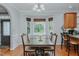 The dining area features a large table and chairs with a bay window providing natural light at 5307 Green Riley Rd, Rougemont, NC 27572