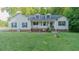 Charming home featuring a well-manicured lawn, white siding, inviting porch, and classic black shutters at 5307 Green Riley Rd, Rougemont, NC 27572