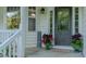 Front porch with a decorative door, manicured plants, and cozy welcome mat at 5307 Green Riley Rd, Rougemont, NC 27572