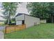 Spacious detached garage and storage shed in a verdant backyard at 5307 Green Riley Rd, Rougemont, NC 27572