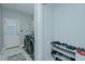 Well-organized laundry room with modern appliances, storage and a shoe rack for convenience at 5307 Green Riley Rd, Rougemont, NC 27572