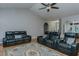 Comfortable leather seating in the living room, featuring a detailed rug and hardwood floors at 5307 Green Riley Rd, Rougemont, NC 27572