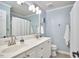 Bathroom featuring double sinks, ample counter space, and neutral wall color at 5328 Willow Cry Ln, Raleigh, NC 27613