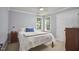 Neutral colored bedroom, illuminated with natural light, includes a full sized closet at 5328 Willow Cry Ln, Raleigh, NC 27613